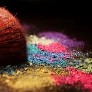 A close up of some colored powder with a brush